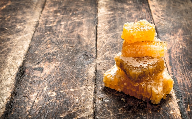 Tower of honeycomb on the wooden background