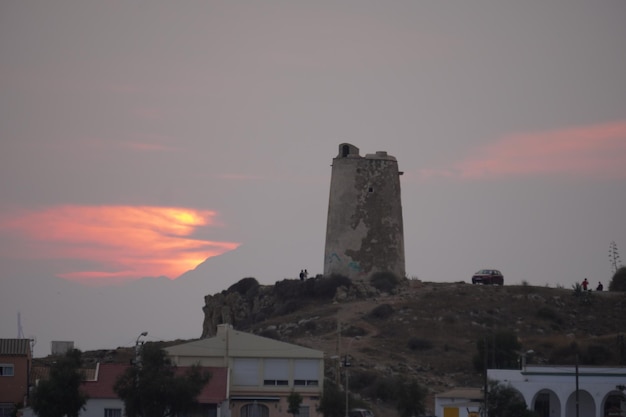 tower near the beach in summer at sunset in mediterranean sea