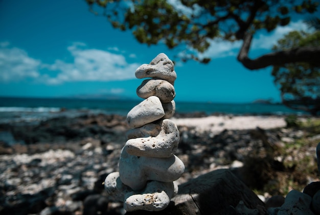 Tower of stones on sea beach background relaxing in the tropical beach with stack of stones