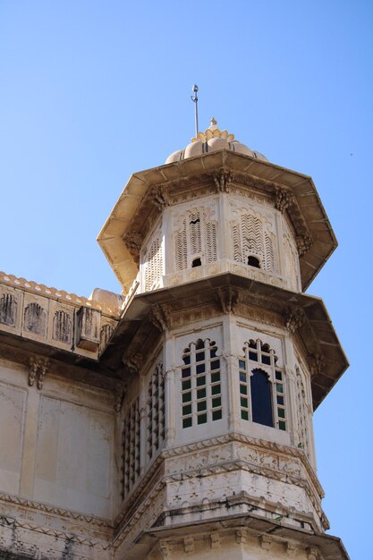 A tower with a blue sky in the background