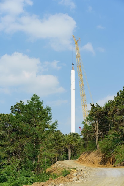 A tower with a crane on it is in the background