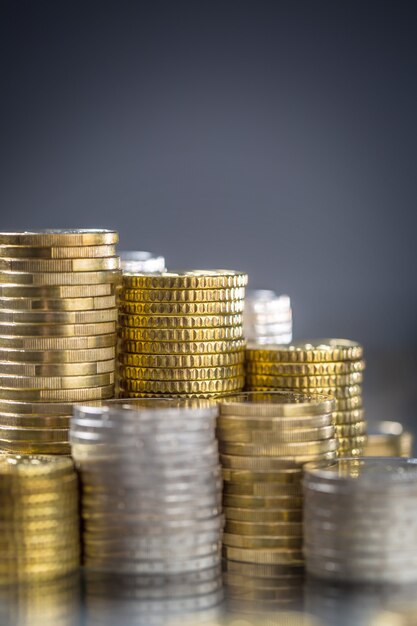 Towers of the euro coins stacked in different positions.