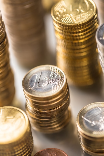 Towers of the euro coins stacked in different positions.