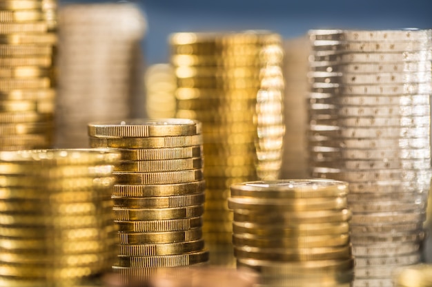 Towers of the euro coins stacked in different positions.