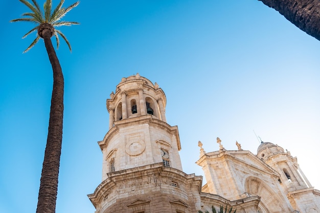 Towers and the facade of the Holy Cathedral Church in the city of Cadiz Andalusia