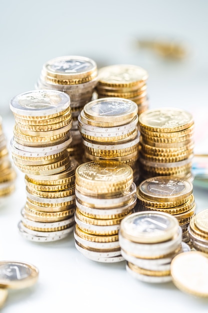 Towers with euro coins stacked together - close-up.