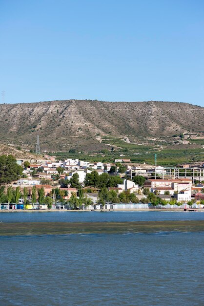 Town by sea against clear sky