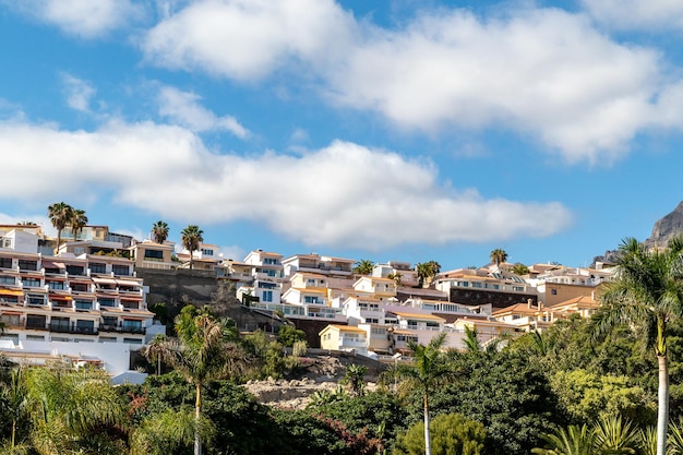 The town of a city is located on a hill overlooking the sea.