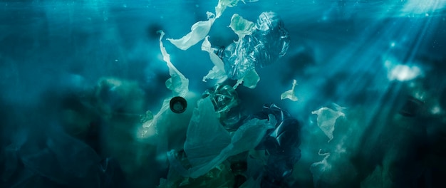 Toxic plastic waste floating underwater in the ocean