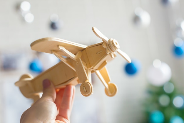 Toy airplane in hand