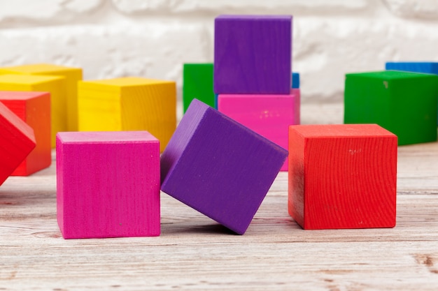 Toy blocks heap, multicolor wooden surface bricks stack 