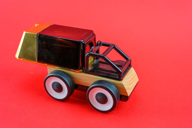 A toy car carries perfume as a gift for Christmas.