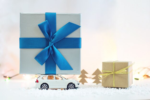 Photo toy car carries on the roof gift for christmas