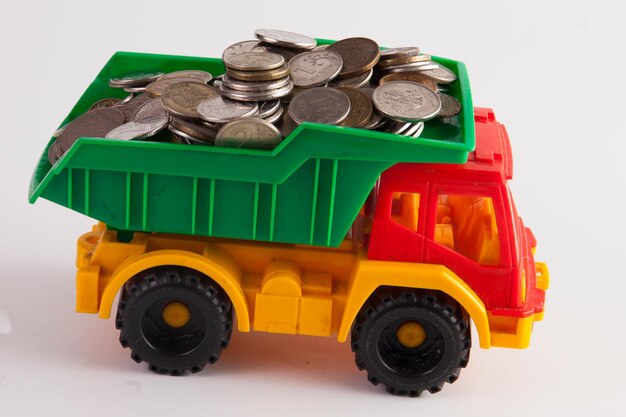 A toy car is carrying a full load of coins