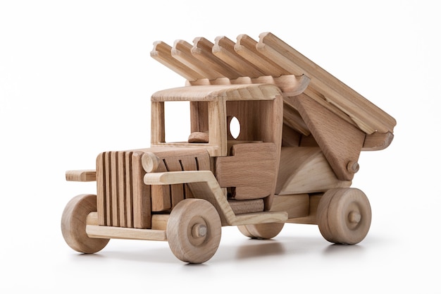 Toy car made of wood isolated on white