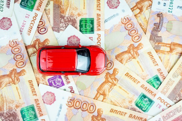 Toy car on money