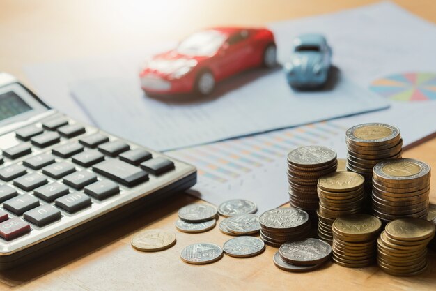 Photo toy car with calculator and money. concept business finance and insurance