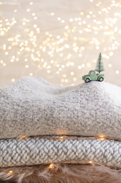 Toy car with a christmas tree, bokeh background