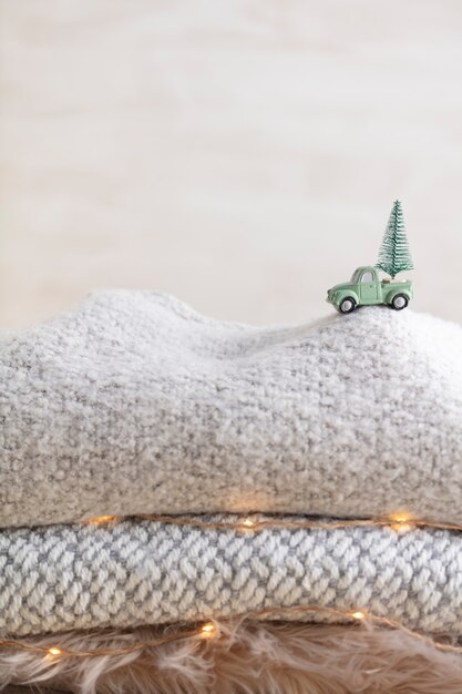 Toy car with a christmas tree, bokeh background