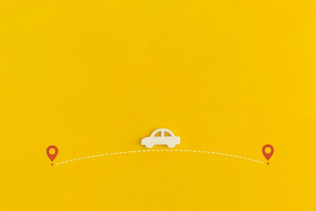 Toy car on a yellow background top view flat lay person