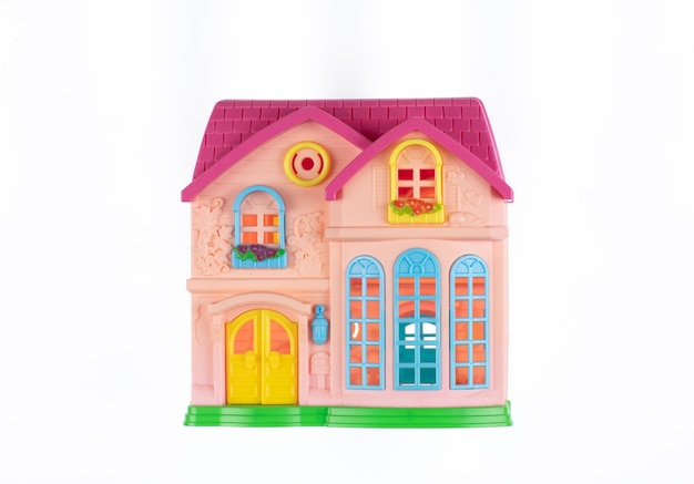 Toy colored plastic house isolated on white background