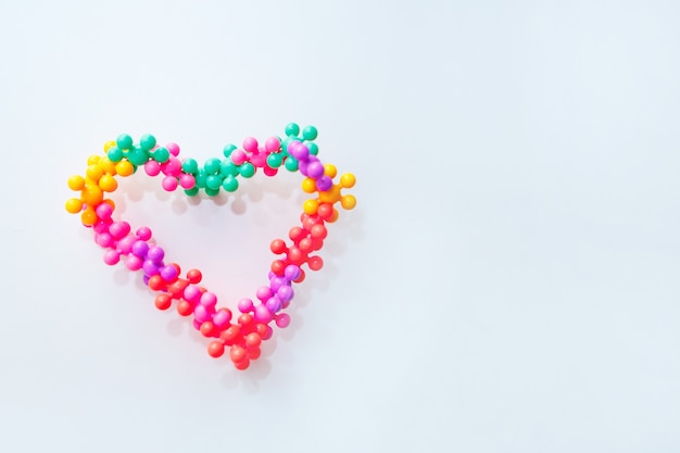 Toy-constructor in the shape of a heart on February 14. Valentine's Day symbol on a white background.