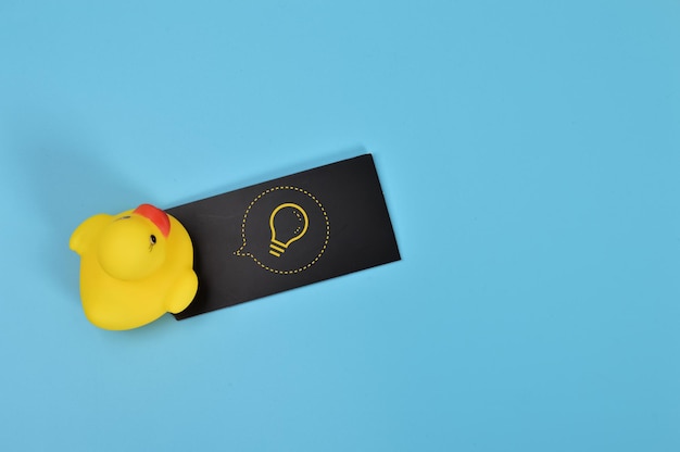 Toy duck and light bulb symbol Innovation creative business growth and new idea concept