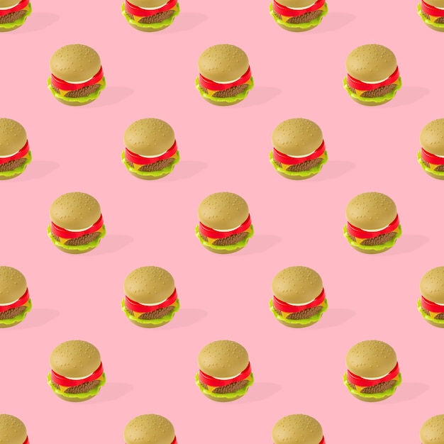 toy hamburger fast food seamless pattern on pink background. unhealthy. not organic