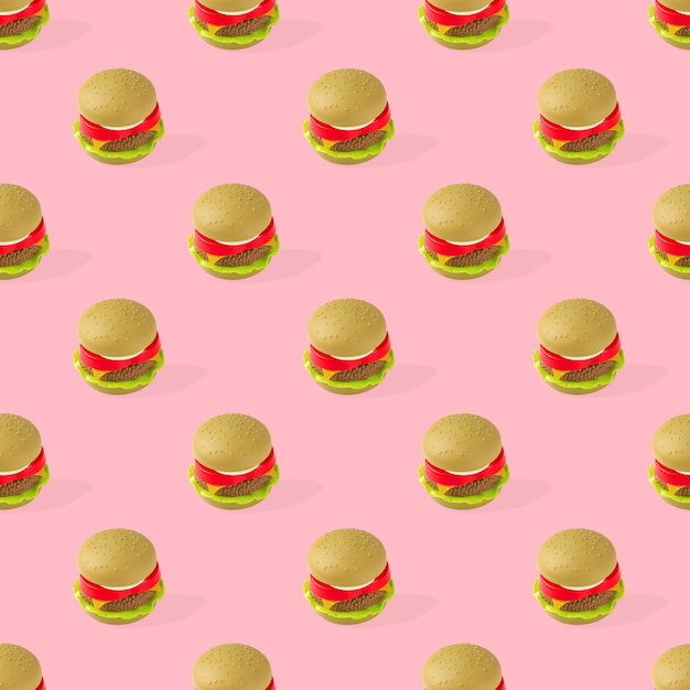 Toy hamburger fast food seamless pattern on pink background. Unhealthy. Not organic