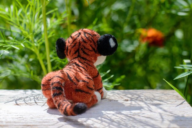 Photo toy handmade tiger, felting wool, rear view