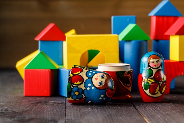 Toy house and family made of wood with blocks