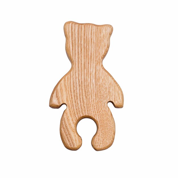 The toy is a wooden bear cub isolated on a white background