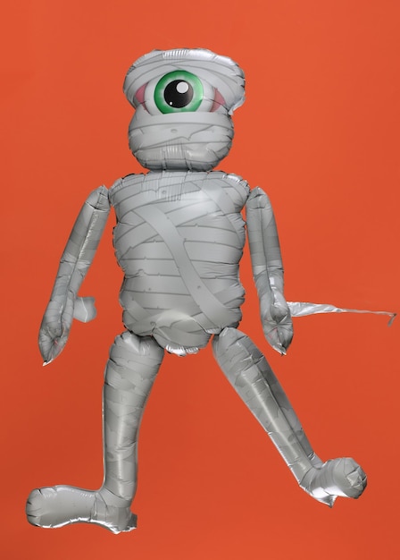 toy mummy on orange background