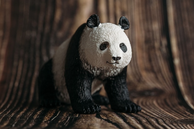 Toy Panda figurine on wooden 