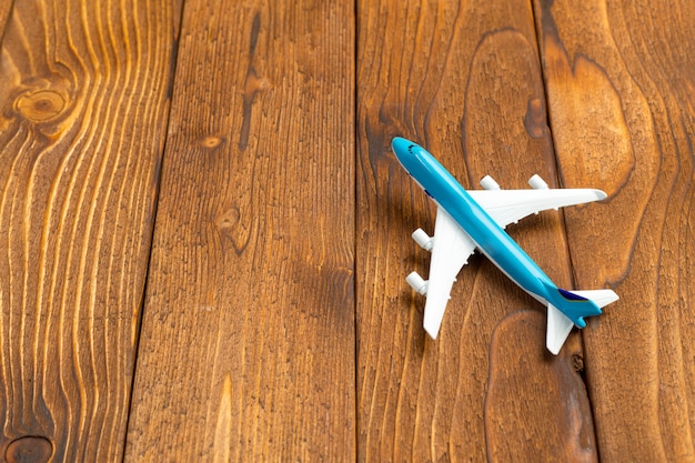 Toy of passenger plane on rustic wooden  