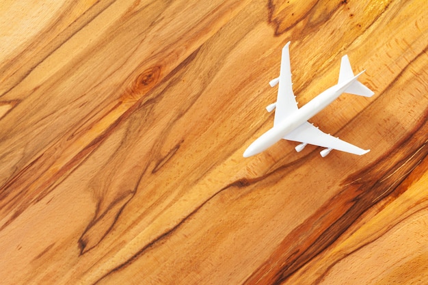 Toy of passenger plane on wooden 