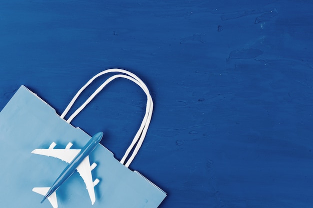 Toy plane on classic blue background, top view