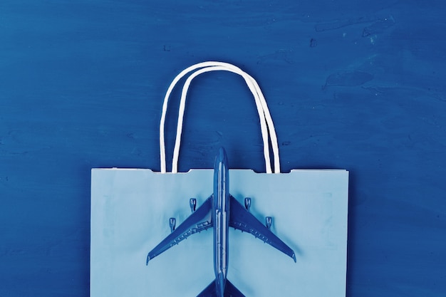 Toy plane on classic blue table, top view