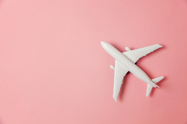 Toy plane on colorful pink background