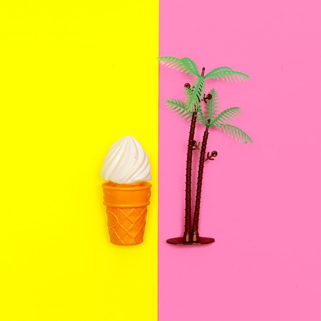 Toy plastic ice cream. Minimal flat lay food art. Summer vacation concept