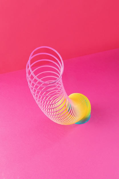 Toy plastic rainbow. A colored spiral for play and stunts, popular in the 90s.  Minimalism. The concept of toys, childhood. brightness.