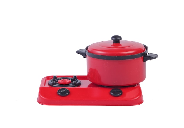 Toy plastic stove with pan isolated on a white. Kid's Kitchen