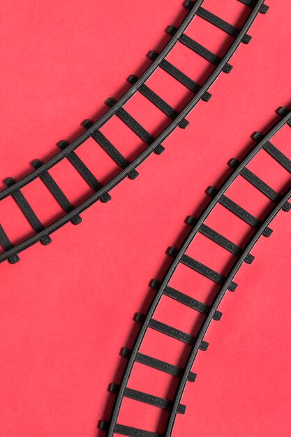 Toy rails on red