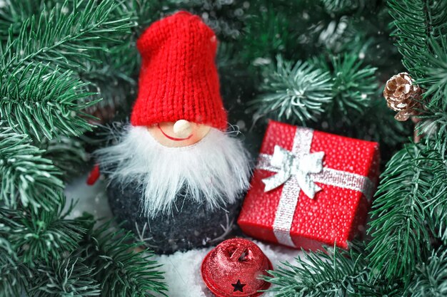  Toy Santa in the branches of a spruce. .