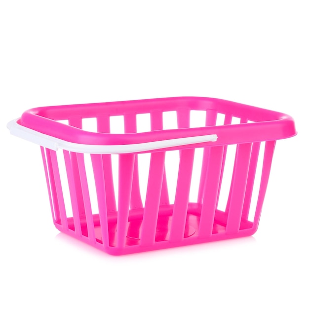 Photo a toy shopping basket isolated on a white background plastic grocery basket closeup the concept of shopping layout for a supermarket