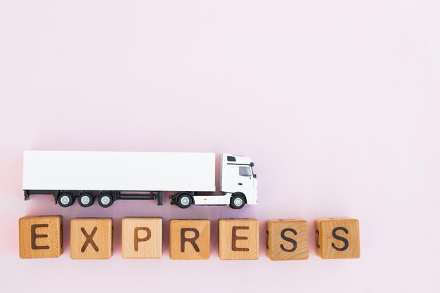 Toy truck with wooden box on purple background Express delivery