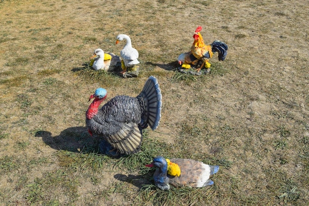 Toy turkeys and chickens in the meadow Home decorations of the house