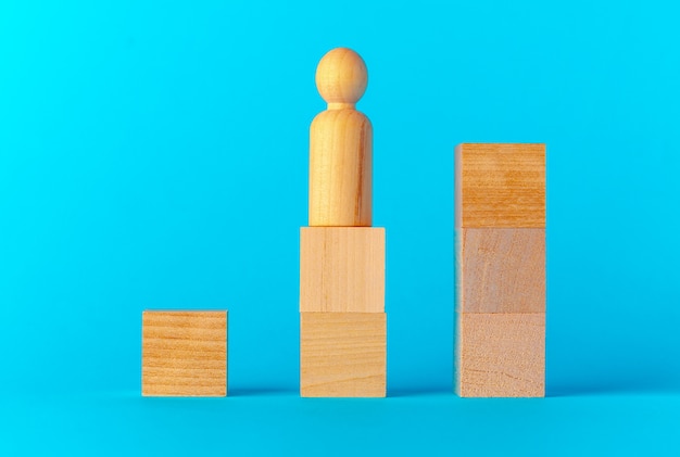 Toy wooden blocks on blue background