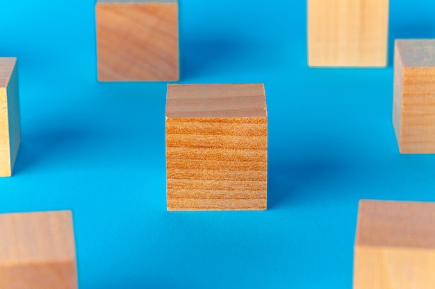 Toy wooden blocks on blue background