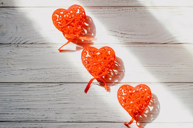 Toys decor hearts on light wooden figured boards